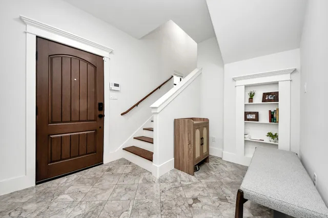 a view of entryway with stairs and furniture