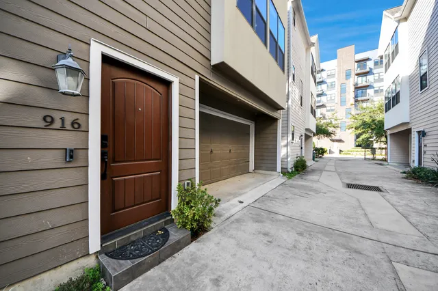 a couple of potted plants in front of a door