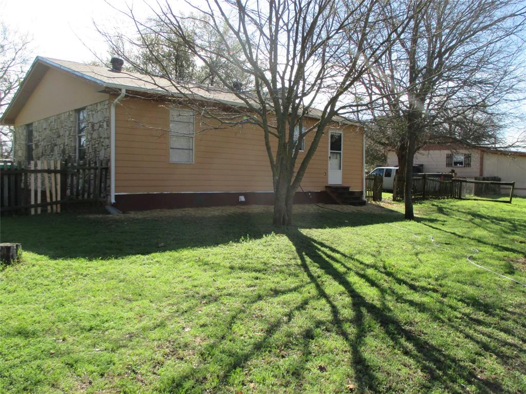 306 North Agnew Street Boyd, TX 76023 - Photo 14 of 15 a house that has a tree in front of it