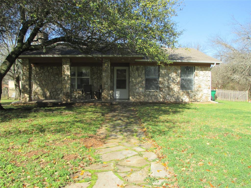 306 North Agnew Street Boyd, TX 76023 - Photo 2 of 15 a front view of a house with a yard