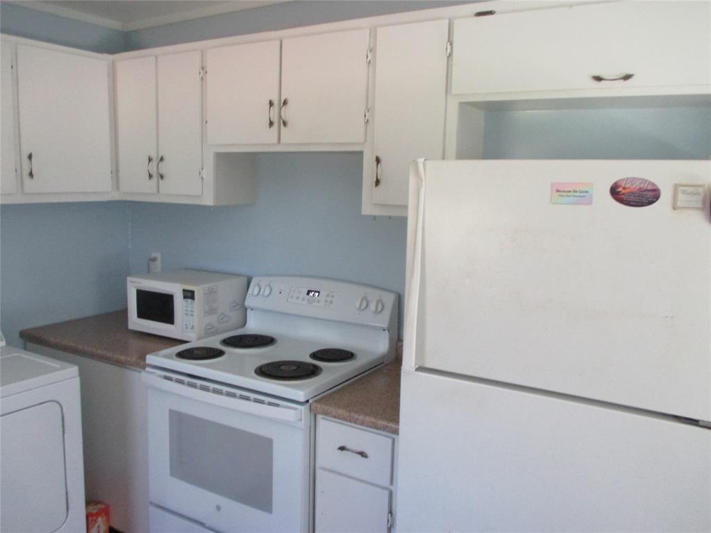 306 North Agnew Street Boyd, TX 76023 - Photo 7 of 15 a utility room with dryer and washer
