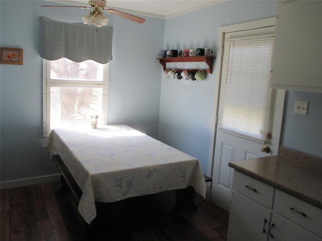 306 North Agnew Street Boyd, TX 76023 - Photo 8 of 15 a bedroom with a bed and a dresser