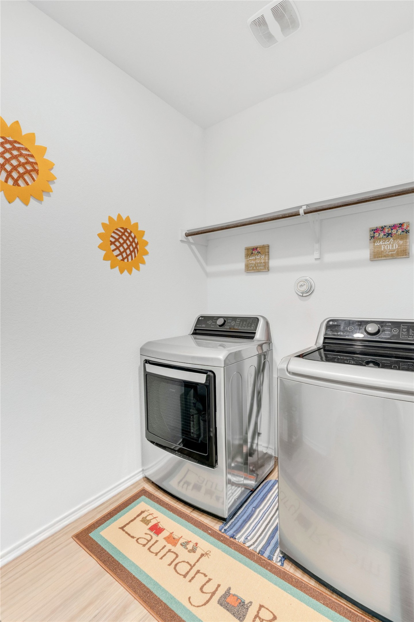 212 Saddle Mountain Road Georgetown, TX 78628 - Photo 13 of 30 A dedicated laundry space offers practical and efficient utility with modern appliances.