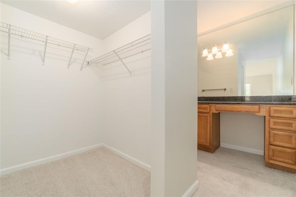 1468 Briarwood Road Northeast, Unit 1304 Brookhaven, GA 30319 - Photo 11 of 17 a bathroom with a sink and a mirror