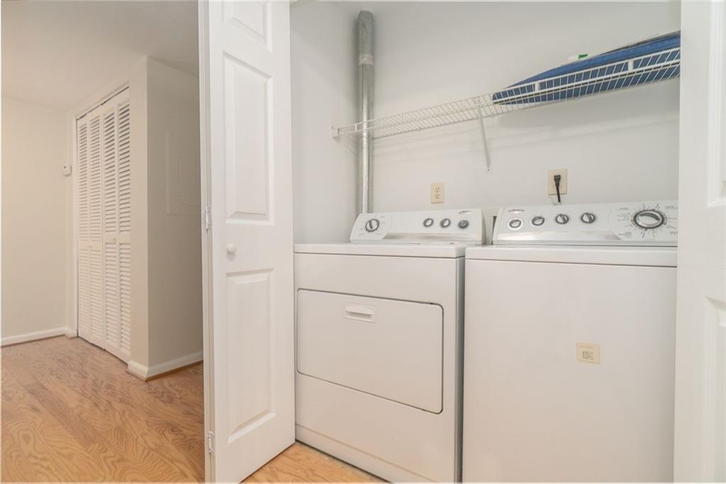 1468 Briarwood Road Northeast, Unit 1304 Brookhaven, GA 30319 - Photo 12 of 17 a utility room with dryer and washer