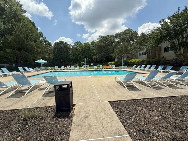 a view of a swimming pool with a patio