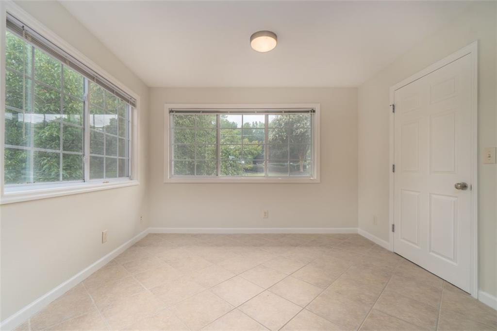 1468 Briarwood Road Northeast, Unit 1304 Brookhaven, GA 30319 - Photo 3 of 17 an empty room with a window