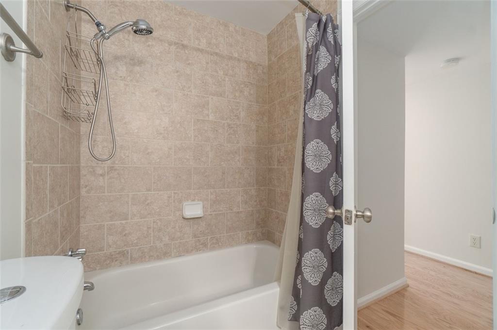 1468 Briarwood Road Northeast, Unit 1304 Brookhaven, GA 30319 - Photo 7 of 17 a bathroom with a shower and a bath tub