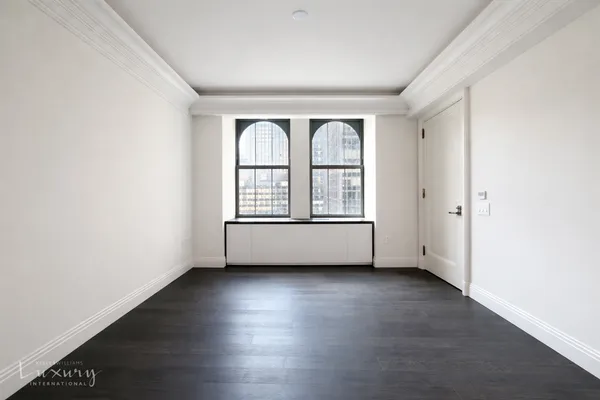 a kitchen with a sink and a large window