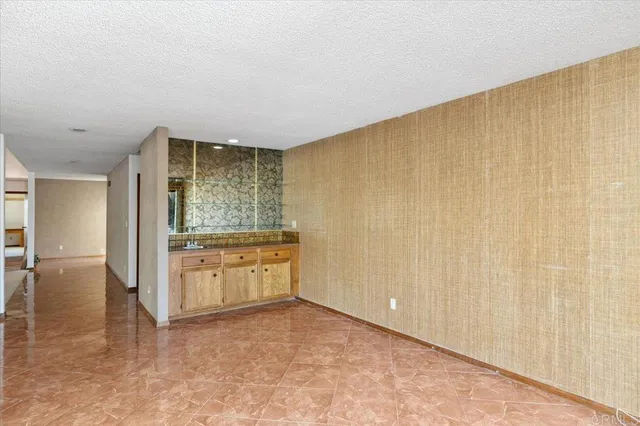 a view of a kitchen with a sink and cabinets