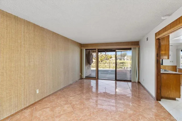 a view of an empty room and window