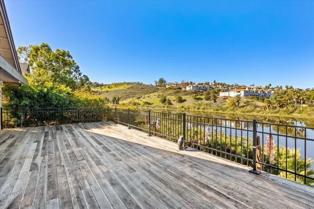a view of balcony with wooden floor and city view