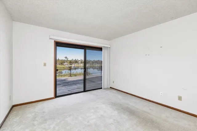 an empty room with sliding glass door