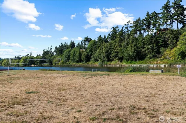 a view of a lake with a yard