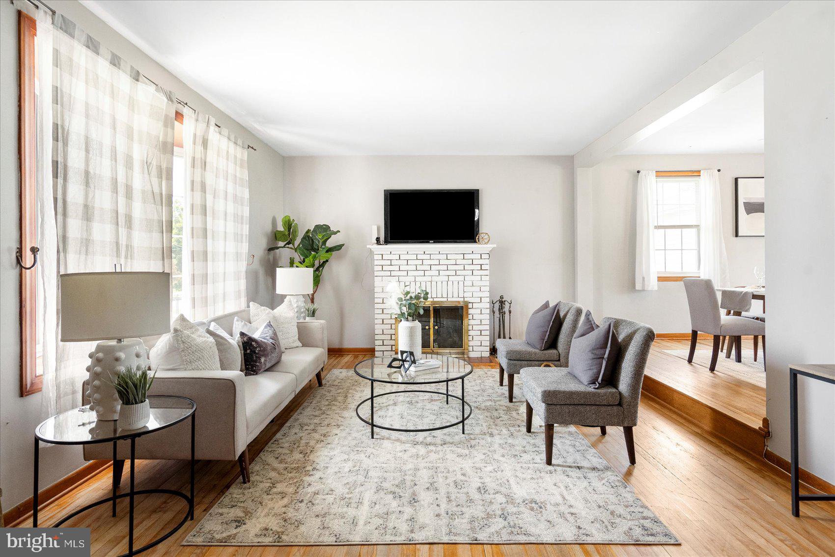 300 Nicholson Road Baltimore, MD 21221 - Photo 1 of 42 a living room with furniture a fireplace and a flat screen tv