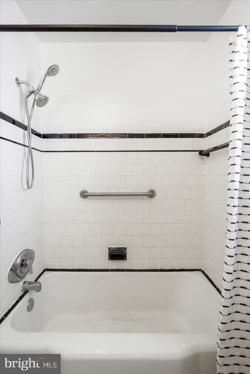 300 Nicholson Road Baltimore, MD 21221 - Photo 28 of 42 a bathroom with a shower and a bath tub