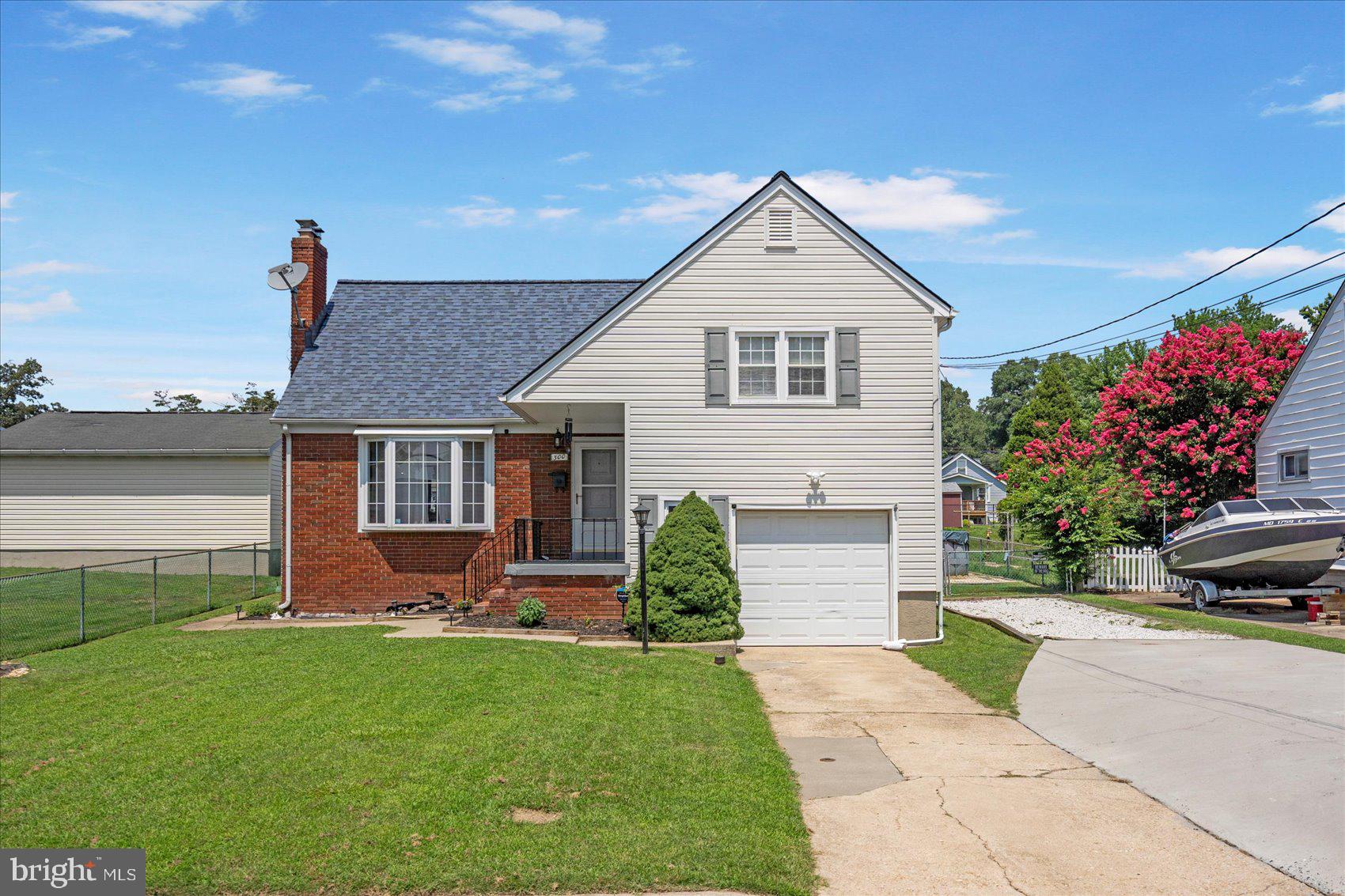 300 Nicholson Road Baltimore, MD 21221 - Photo 40 of 42 a front view of a house with a yard