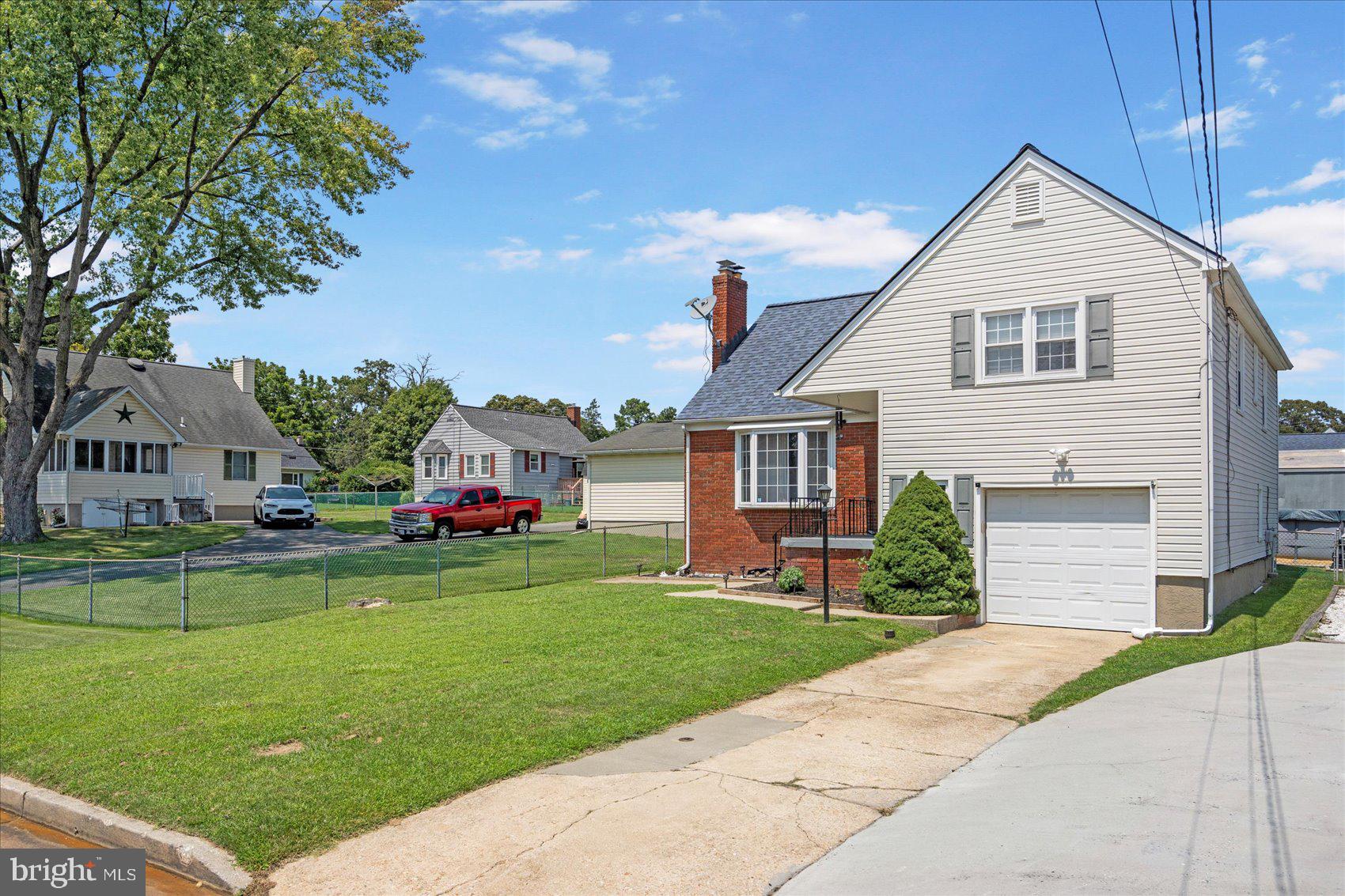 300 Nicholson Road Baltimore, MD 21221 - Photo 42 of 42 a front view of a house with a yard and garage