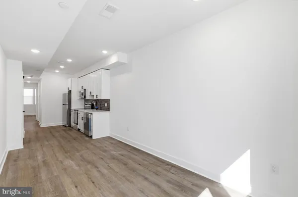 a view of kitchen with wooden floor