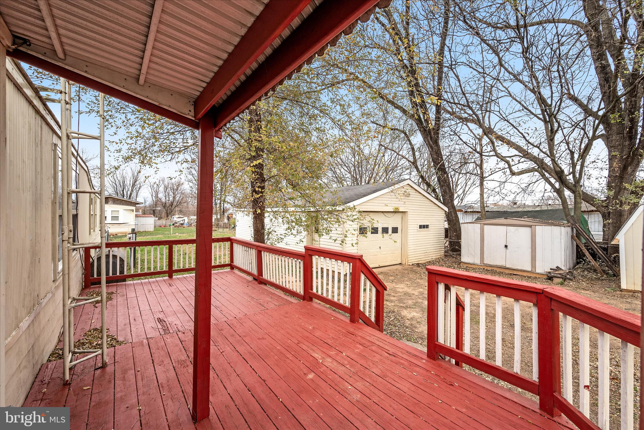 53 Anvil Road Kearneysville, WV 25430 - Photo 11 of 44 a view of a house with wooden deck next to a yard