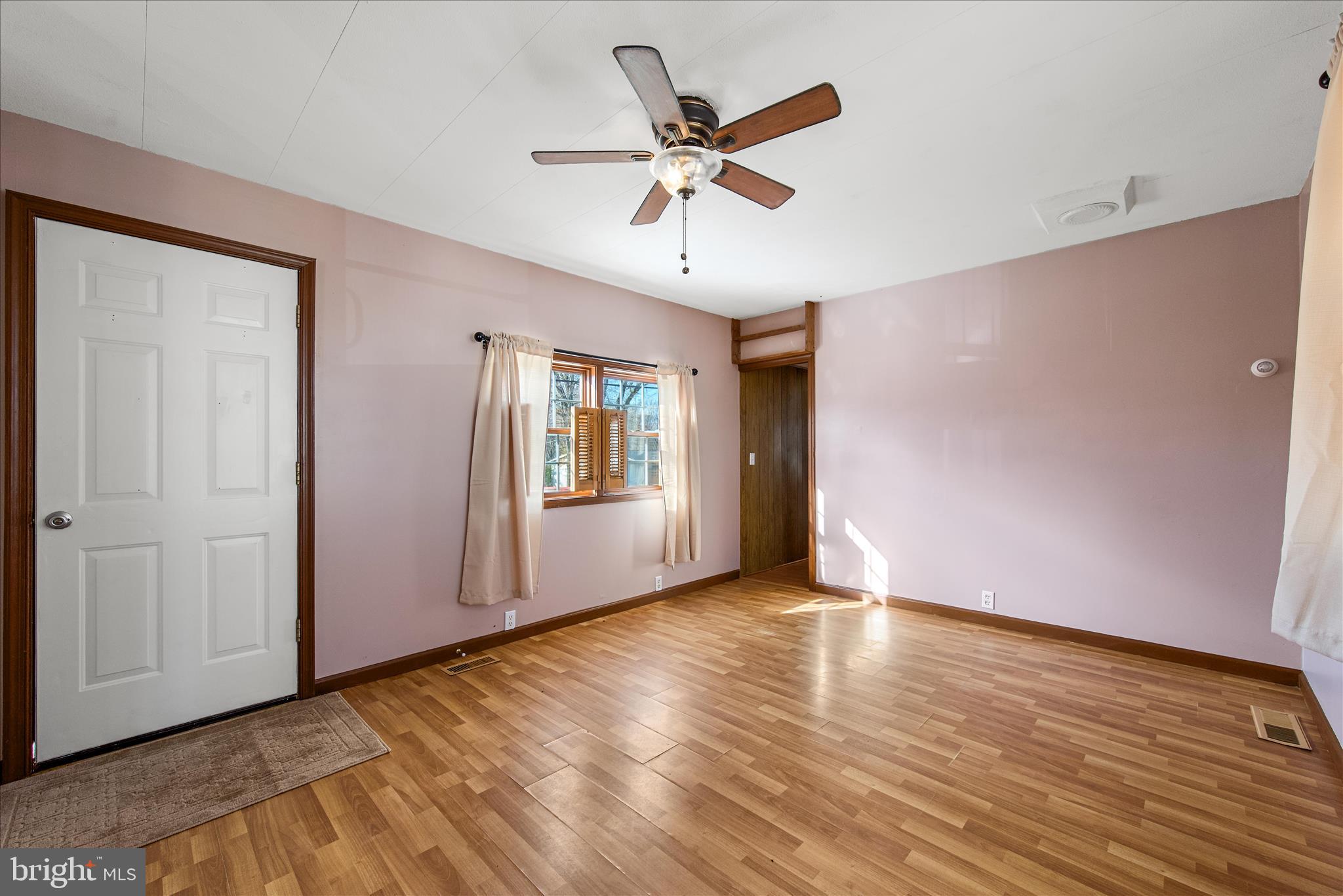 53 Anvil Road Kearneysville, WV 25430 - Photo 13 of 44 a view of an empty room with window and wooden floor