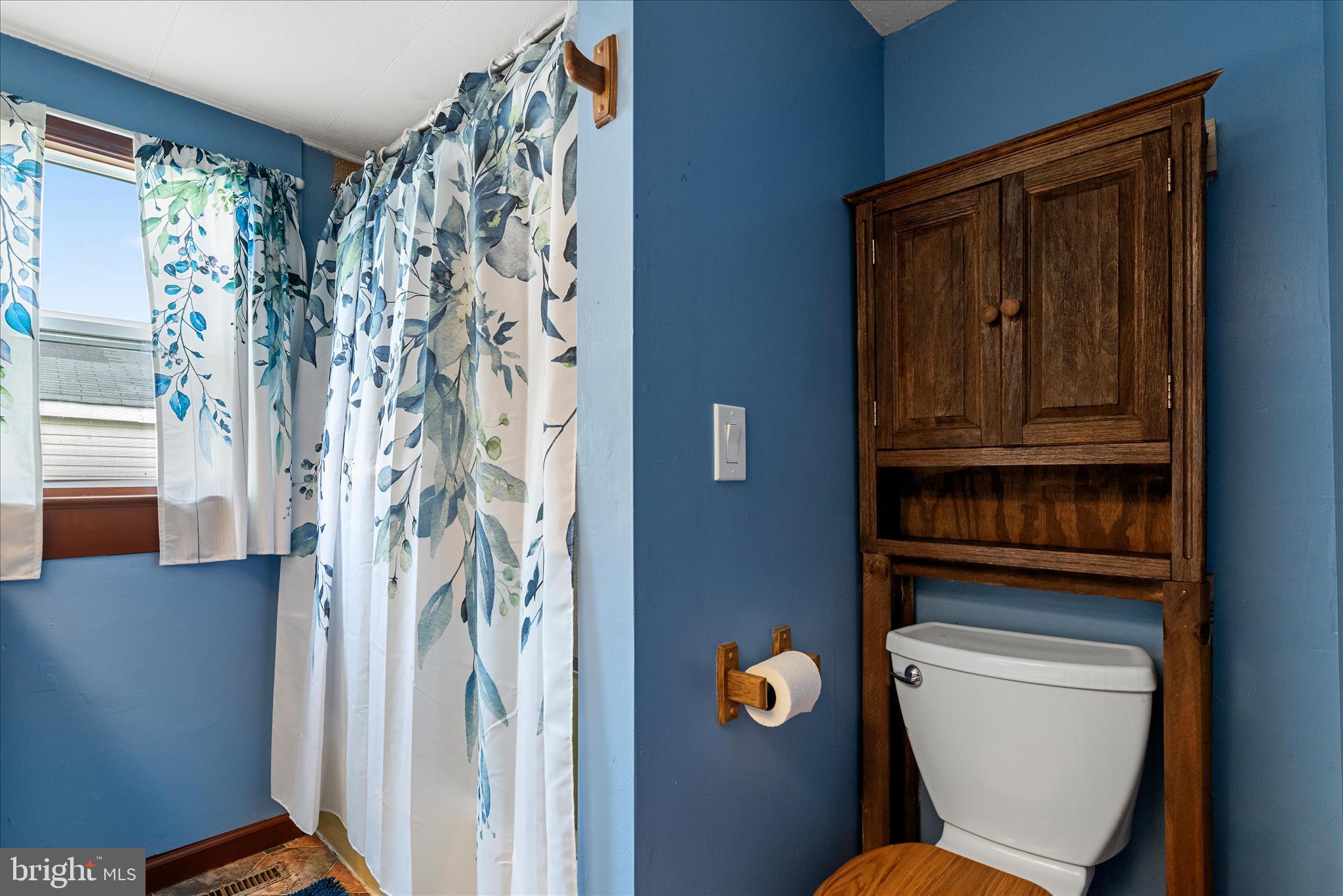 53 Anvil Road Kearneysville, WV 25430 - Photo 19 of 44 a bathroom with a toilet and a shower curtain