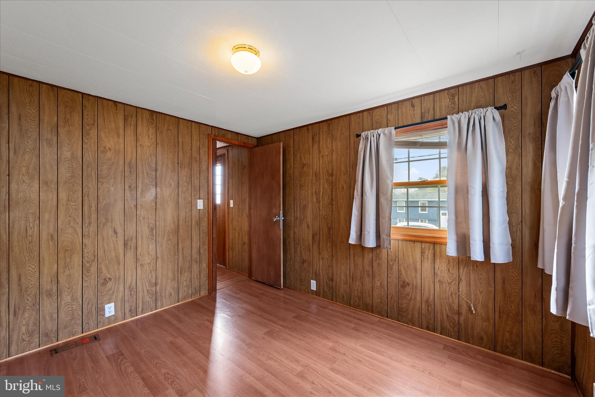 53 Anvil Road Kearneysville, WV 25430 - Photo 22 of 44 an empty room with windows and wooden floor