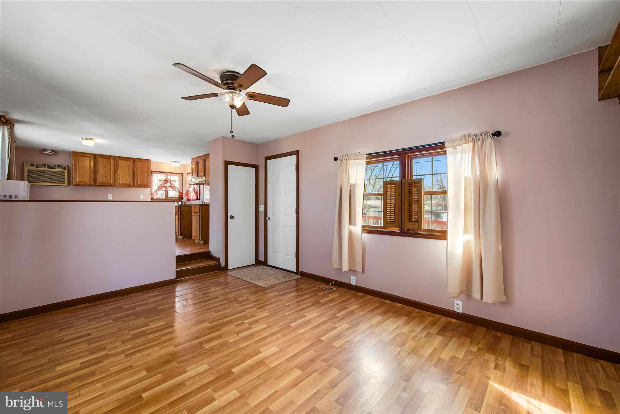 53 Anvil Road Kearneysville, WV 25430 - Photo 3 of 44 a view of an empty room with window and wooden floor