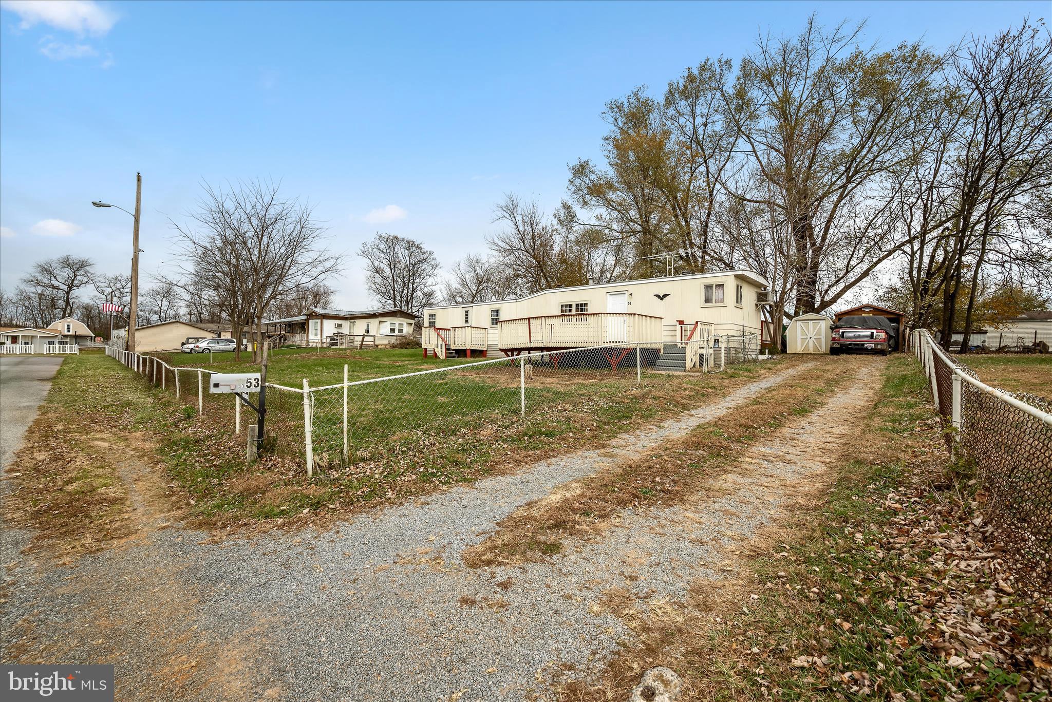53 Anvil Road Kearneysville, WV 25430 - Photo 32 of 44 a backyard of a house with table and chairs
