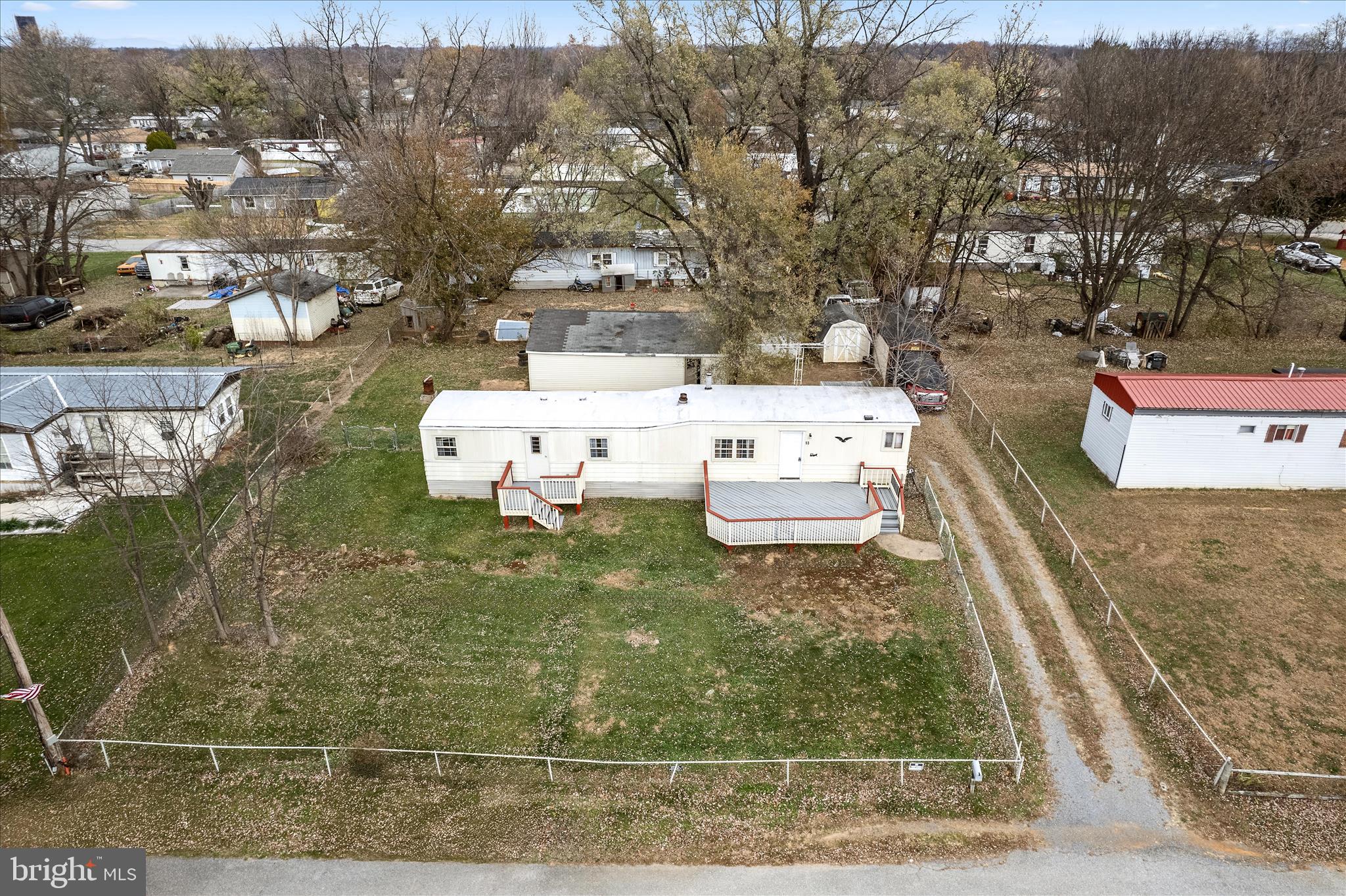 53 Anvil Road Kearneysville, WV 25430 - Photo 41 of 44 a white building covered with tall trees