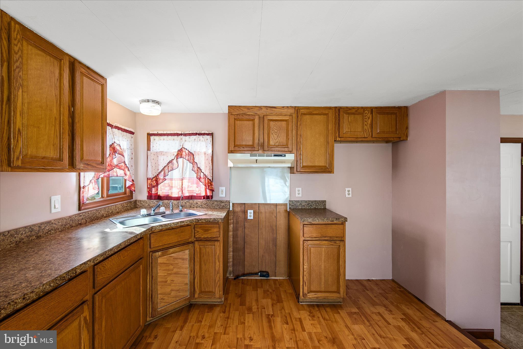 53 Anvil Road Kearneysville, WV 25430 - Photo 8 of 44 a view of a kitchen with a sink and wooden floor
