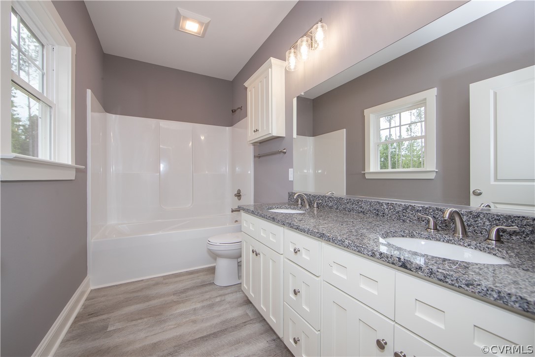 26 Perkins Road Cartersville, VA 23027 - Photo 13 of 22 The master bathroom offers LVP flooring, Granite c