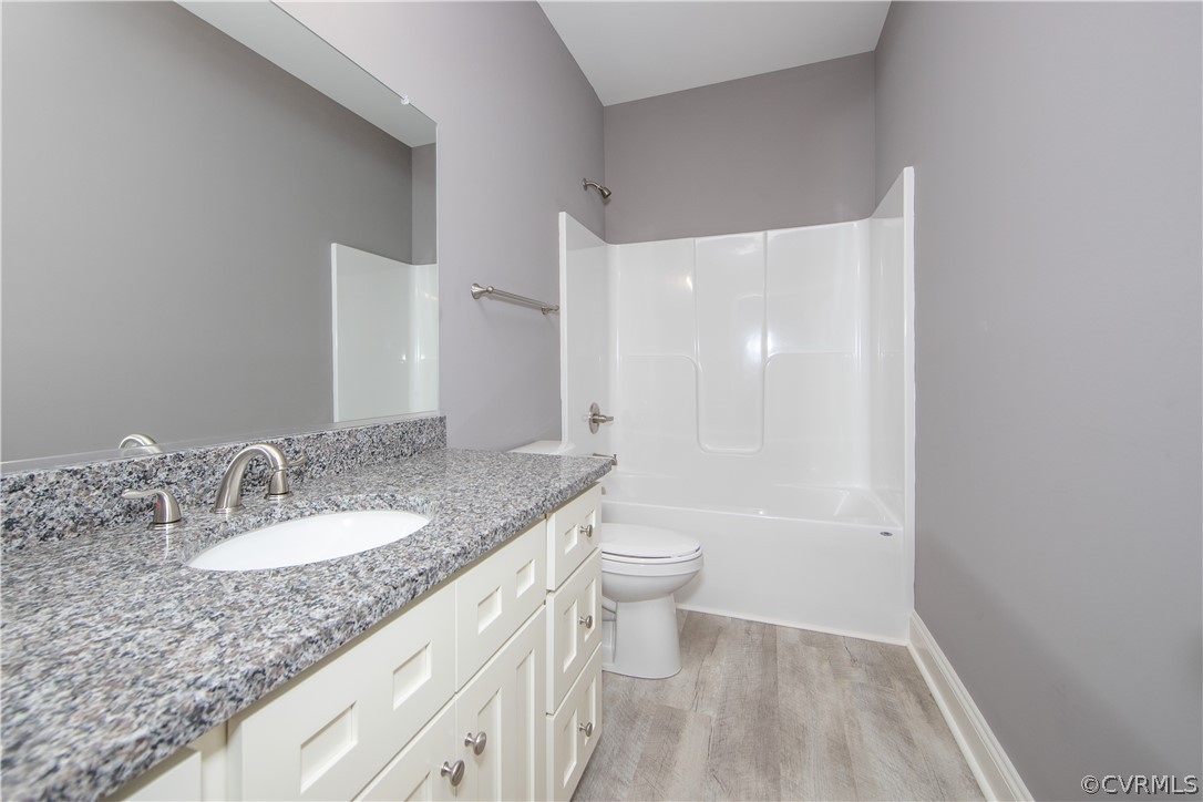 26 Perkins Road Cartersville, VA 23027 - Photo 16 of 22 The hall bath has granite counter tops, LPV floori