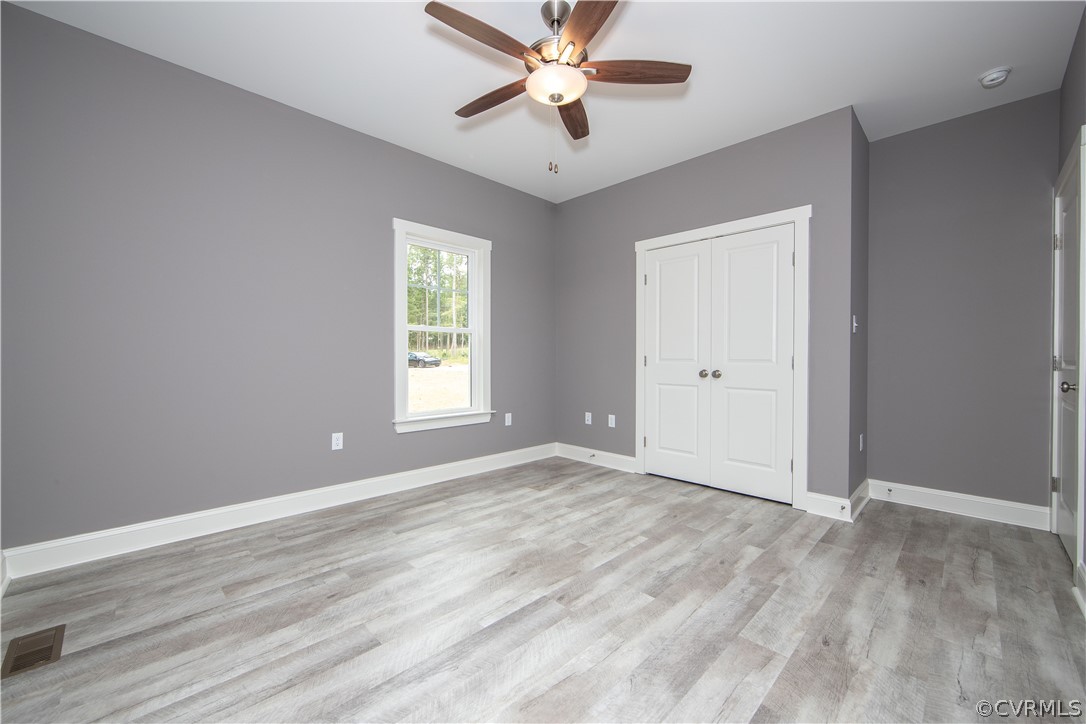 26 Perkins Road Cartersville, VA 23027 - Photo 17 of 22 Bedroom three also boasts a ceiling fan and large