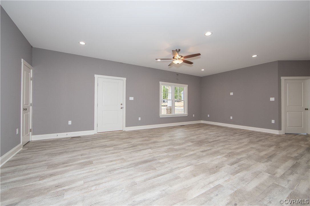 26 Perkins Road Cartersville, VA 23027 - Photo 8 of 22 The spacious living room has LVP flooring, and cei