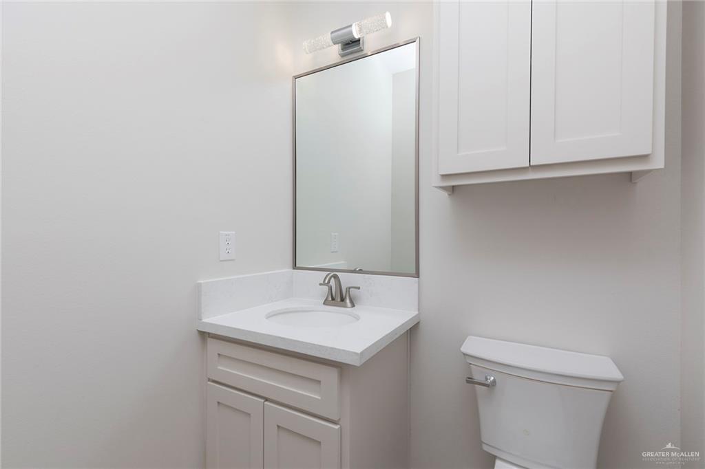 2405 Northgate Lane McAllen, TX 78504 - Photo 13 of 18 a bathroom with a sink toilet and vanity