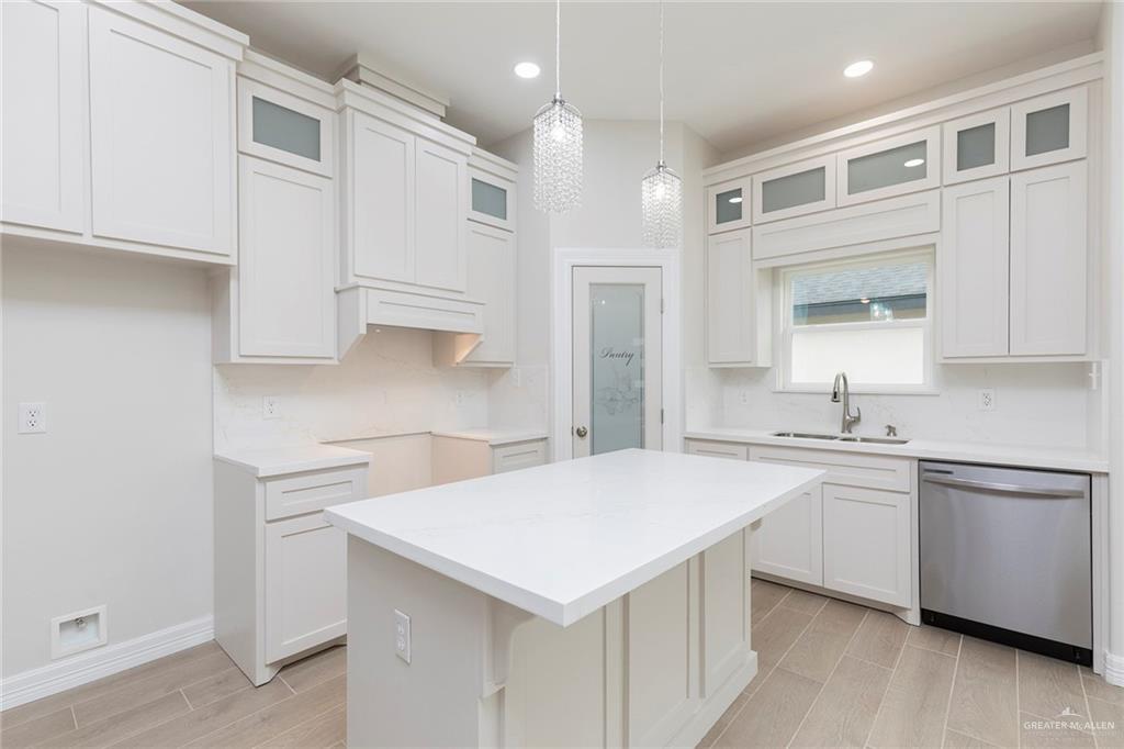 2405 Northgate Lane McAllen, TX 78504 - Photo 3 of 18 a kitchen with stainless steel appliances a sink a stove a refrigerator and cabinets