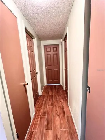a view of a room with wooden floor and staircase