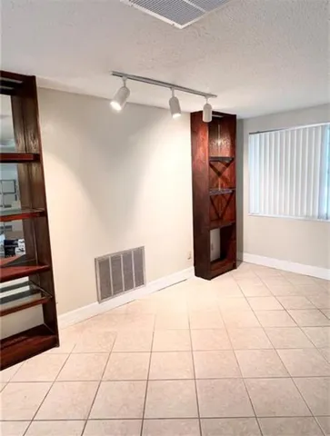 a bedroom with a bed and a walk in closet