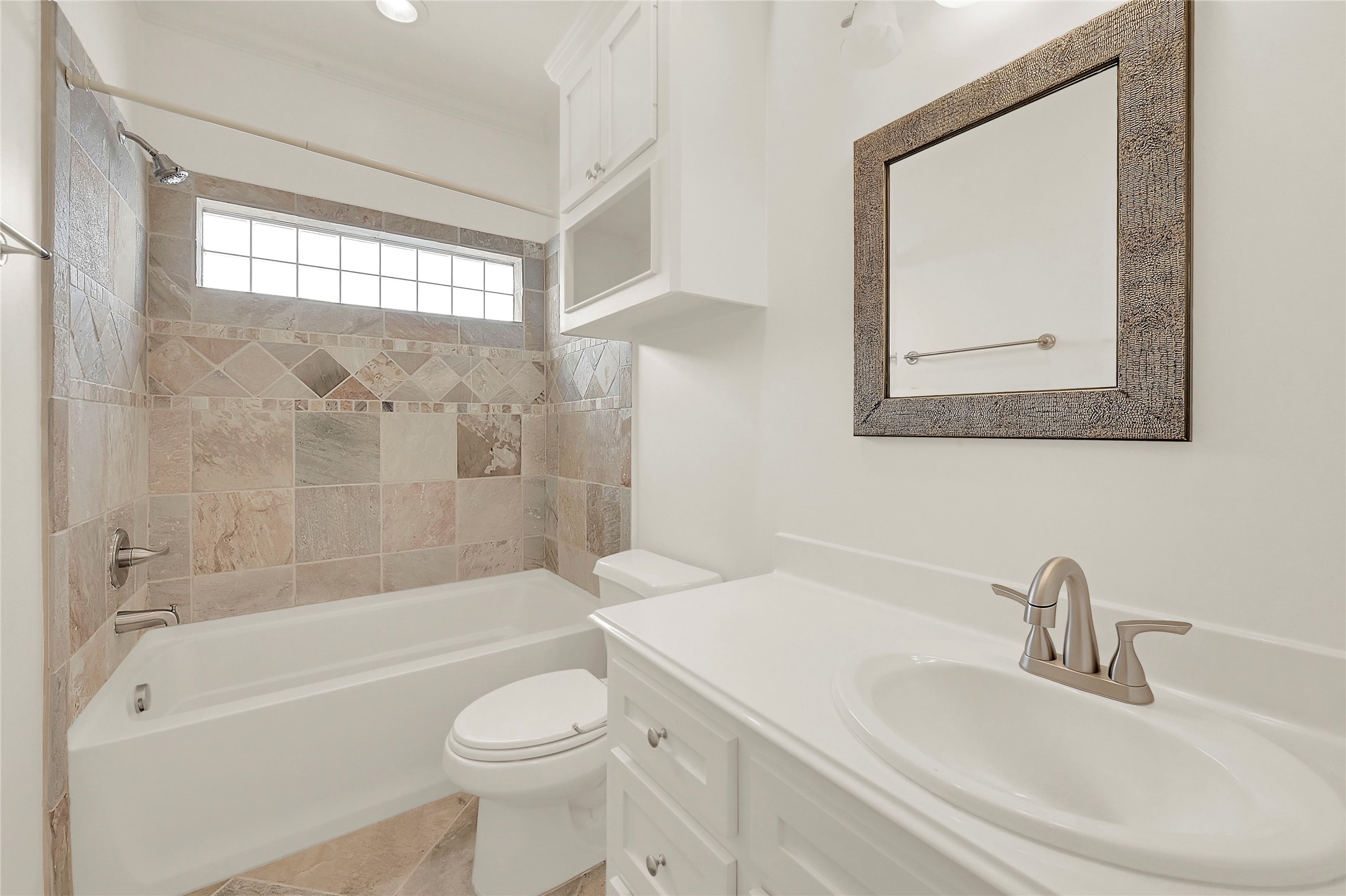 4418 Edsee Street Houston, TX 77009 - Photo 24 of 28 The home's second full bathroom boasts gorgeous Texas Limestone tile, and a clean, fresh feel.