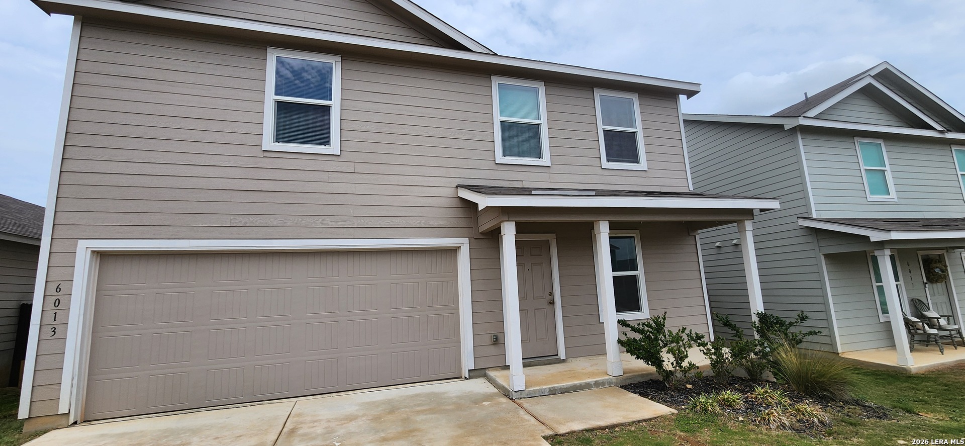 6013 Companion Loop Bulverde, TX 78163 - Photo 1 of 37 a front view of a house with garden