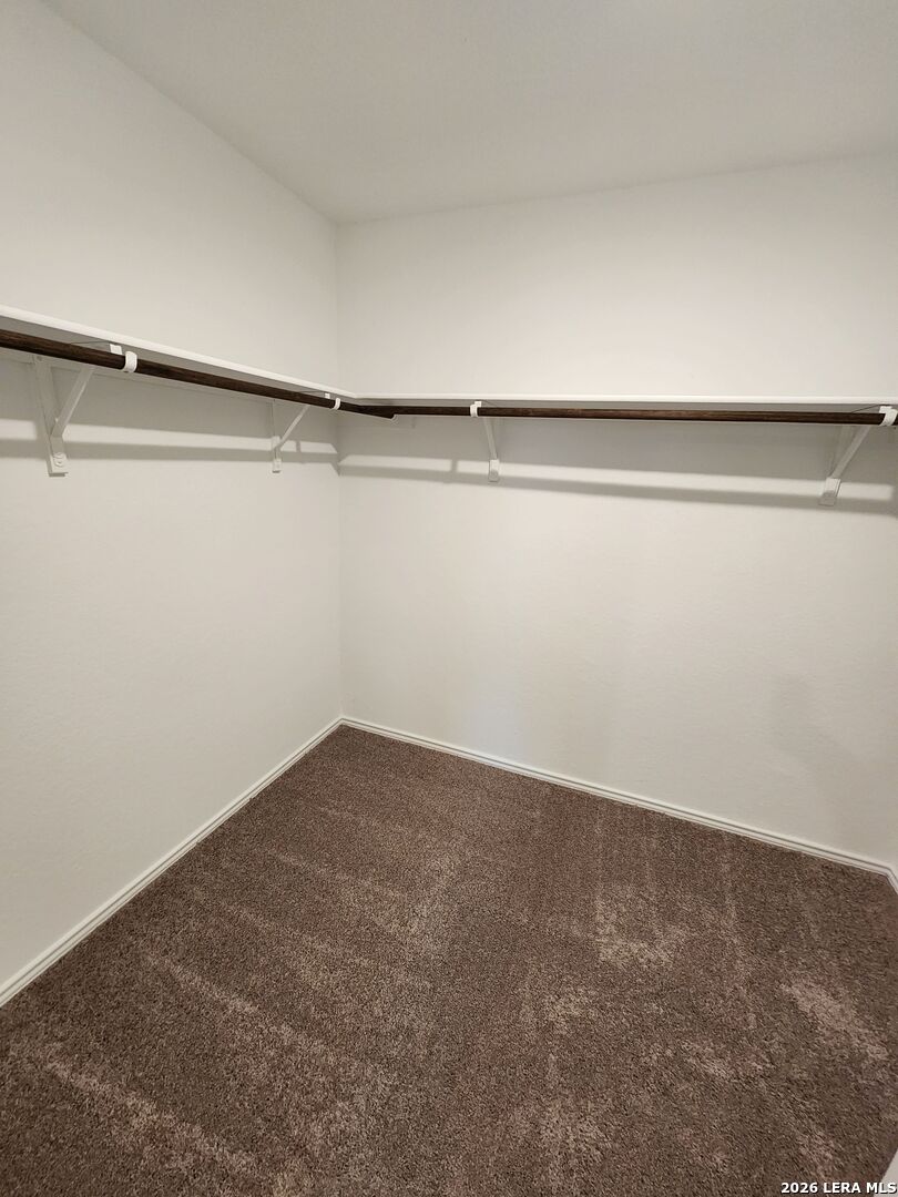 6013 Companion Loop Bulverde, TX 78163 - Photo 14 of 37 a view of small space with racks on the wall