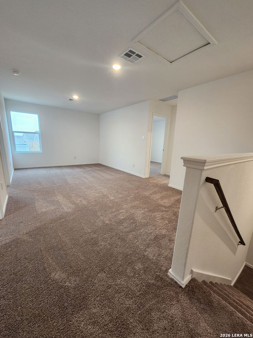 6013 Companion Loop Bulverde, TX 78163 - Photo 30 of 37 an empty room with a staircase