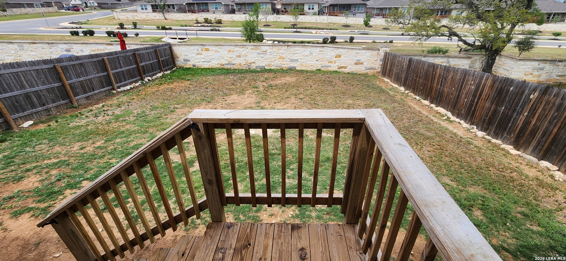 6013 Companion Loop Bulverde, TX 78163 - Photo 32 of 37 a view of balcony with wooden floor and seating