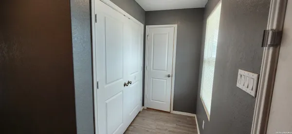 a view of a bathroom from the hallway