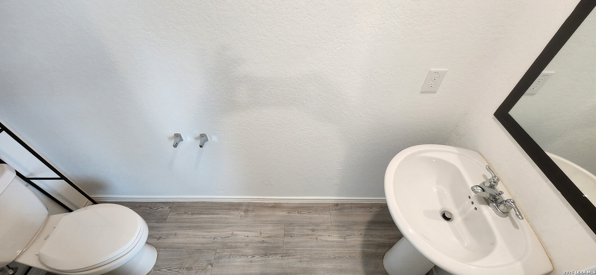 6013 Companion Loop Bulverde, TX 78163 - Photo 8 of 37 a bathroom with a toilet and a mirror