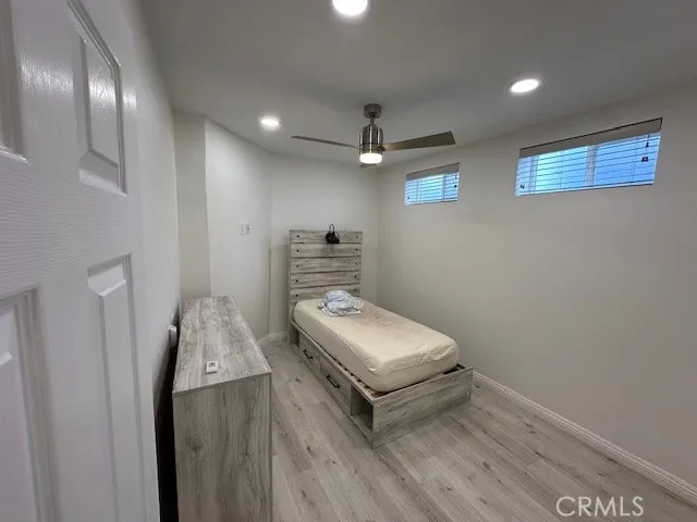 a room with a bed and a chandelier