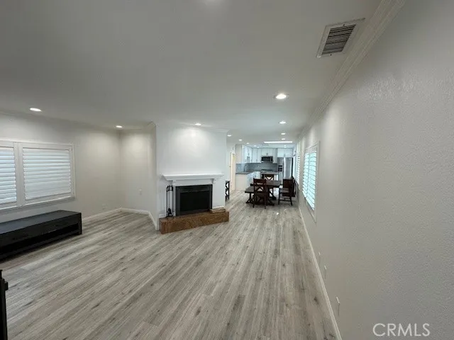 a view of living room with furniture and fireplace