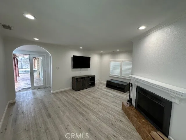 a view of kitchen with microwave and stove top oven