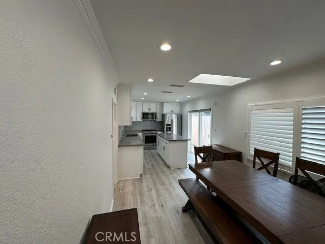 a view of a dining hall with furniture and wooden floor